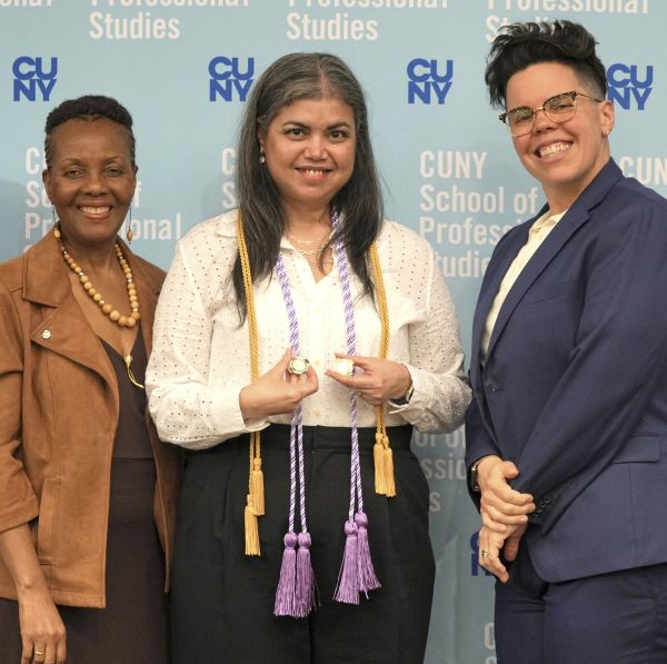 Nursing student receiving pin and cord.