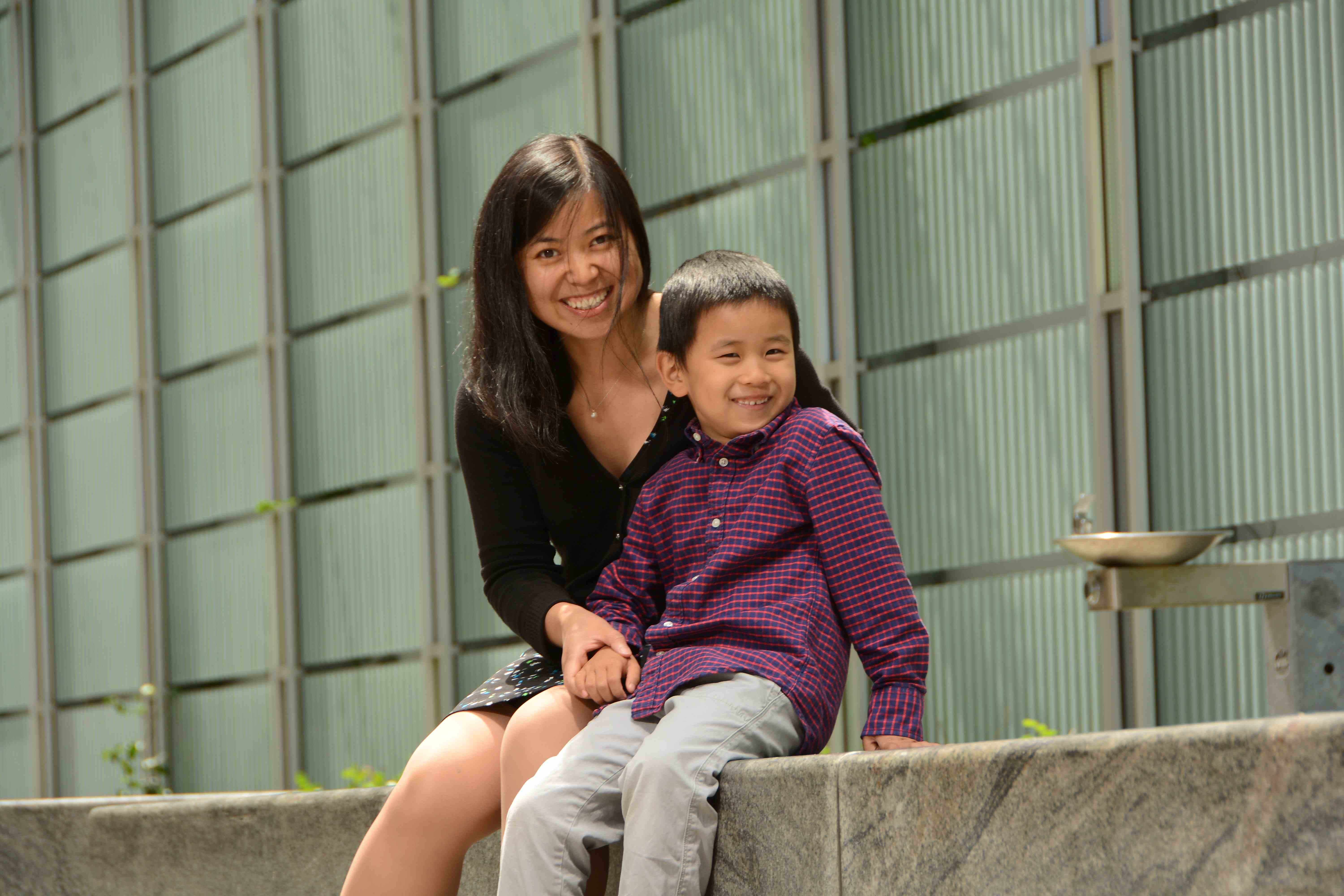 Woman siting outside with her son