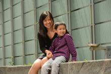 Woman siting outside with her son